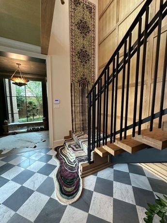 Elegant Multicolor Rug Flowing Along the Stairs and Wall-1